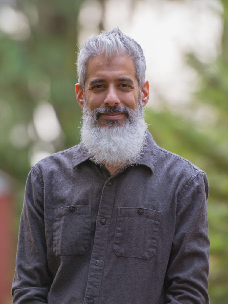 Close-up portrait of Cyrus Jagosh outdoors, looking directly at the camera