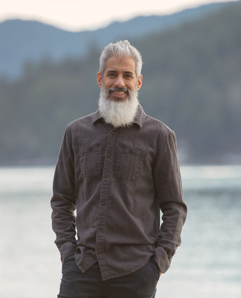 Cyrus Jagosh, Registered Therapeutic Counsellor, standing by the water in Vancouver, British Columbia